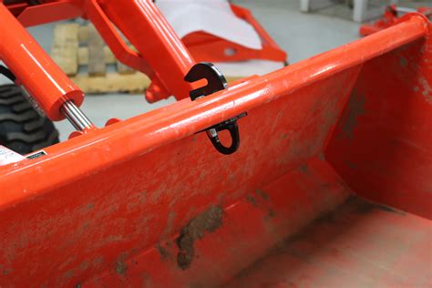 best way to mount hooks on skid steer bucket|kubota bucket hook installation guide.